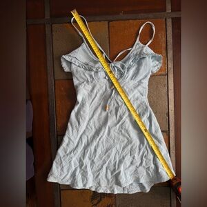 Free people medium romper baby blue spaghetti straps wooden tie ruffle preppy